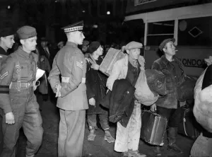 Refugees Prints: Civilians evacuated from The Normandy invasion area seen have arriving at Waterloo
