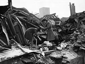 Bombed Prints: Civilians salvage belongings after a bombing raid in Chichester. 11th February 1943