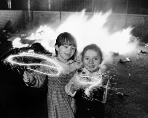 Bonfire Night Prints: Clare aged 6 and Lindsay Gerard aged four (right) enjoying their sparklers at an