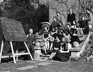 Instruction Prints: Class of would be women railway clerks having there final lesson in the ground of a