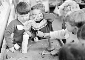 00187 Prints: Classroom scene shows children playing in the sandpit at Ravensdale Infants school