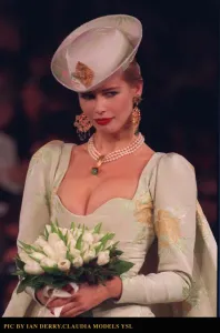 Supermodel Prints: Claudia Schiffer models a wedding dress by Yves Saint Laurent at the Paris Fashion Show