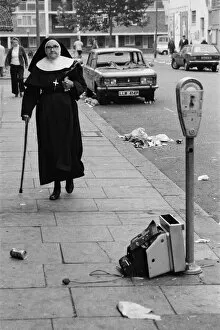 01069 Collection: Cleaning-up began in the streets of Notting Hill after monday nights rioting following