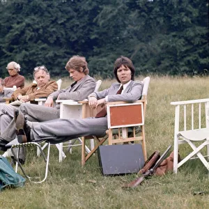 Cliff Richard and Anthony Andrews seen here relaxing between takes on location filming