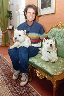 Pets Collection: Cliff Richard with his two dogs. 17th June 1995