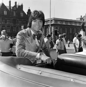 Cliff Richard leaving a Birmingham hotel for location work on his latest film