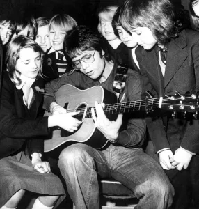 Cliff Richard pictured with pupils during a surprise visit to Binley Park School