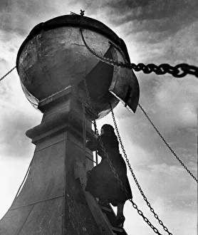 Climbing up a perilous wind swept ladder into the golden ball on the church tower of St