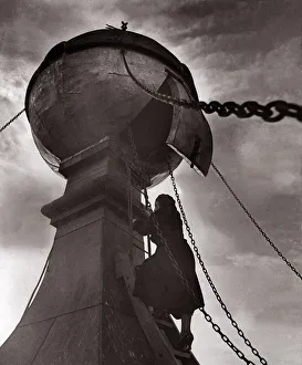 Climbing up a perilous wind swept ladder into the golden ball on the church tower of St