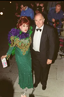 01057 Prints: Clive James arrives for the 1995 Comedy Awards with Margarita Pracatan