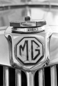 Logo Prints: Close up og the MG logo on a vintage car January 1975 75-00391-002