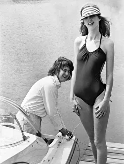 Clothing Beach. Model Carol Dwyer gets a cheeky glance as she poses in a revealing