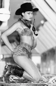 00025 Prints: Clothing : Beachwear. Model Nikki G gets wild over the west