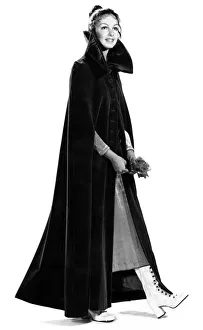 Clothing: We dressed Biddy Lampard in a nun'-like dark purple cape