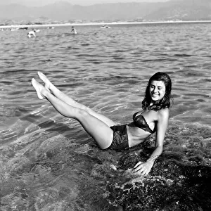 Clothing: Fashion: Beachwear: Holidaymakers: Bathing: Beauties seen here cooling off in