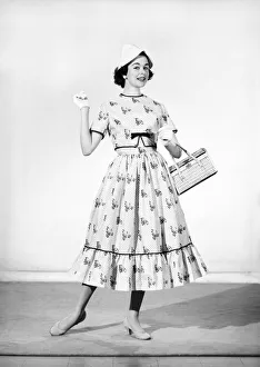 Clothing: Fashion: Dresses. Woman wearing full length dress with matching gloves