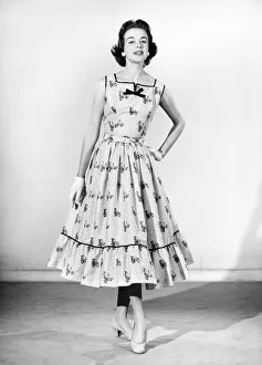 Clothing: Fashion: Dresses. Woman wearing full length dress with matching gloves