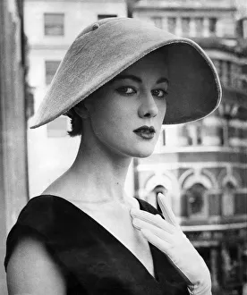 00371 Prints: Clothing-Fashion: Hats: Bloching hats: Velnet collie hat by Ronald Peterson. July 1954