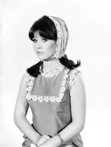 Headscarf Prints: Clothing: Fashion: Hats: Woman wearing granny hood. Model: Rosemary Bell. 1966 B1965-004