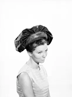 Clothing: Fashion: Hats: Woman wearing hats with veils. 1962 B1544-040