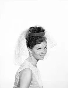 Clothing: Fashion: Hats: Woman wearing hats with veils. 1962 B1544-038