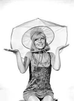 Clothing: Fashion: Hats: Woman wearing umbrella hat. Model: Marilyn Rickard