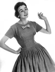 00053 Prints: Clothing Fashion: Jackie Jackson modelling a knitted dress with bow tie detail