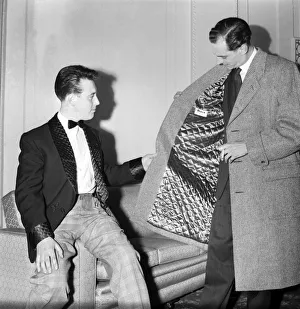 Clothing: Fashion: Men. Two of the male mannequins preparing themselves for the first
