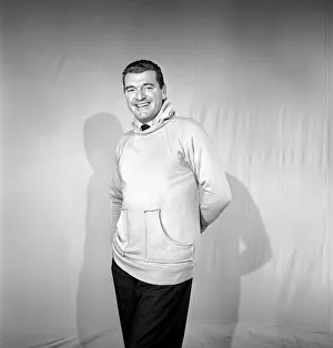 Clothing: Fashion: Menswear. Man wearing hooded sweat shirt. 1958 B116-002