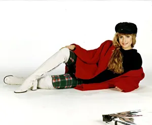 Leggings Prints: Clothing Fashion from Miss Selfridge model in white boots tartan leggings black top hat