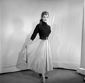 Skirt Prints: Clothing: Fashion: Skirts: Woman wearing pleated skirt. 1953 B127-002