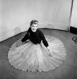 Clothing: Fashion: Skirts: Woman wearing pleated skirt. 1953 B127-001