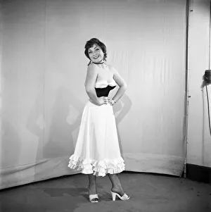 00435 Prints: Clothing: Fashion: Spanish Skirt: Woman wearing flamenco style skirt. 1959 E98-002
