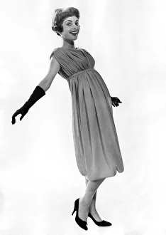 00053 Prints: Clothing Fashions: Model wearing detailed belted evening dress
