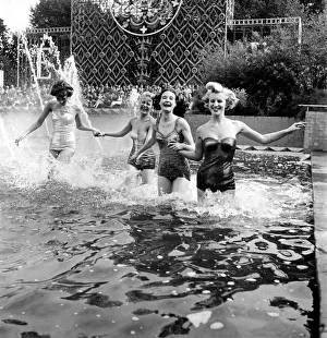 00037 Prints: Clothing Holiday Fashions. Cabaret girls seen here modeling swimsuit. July 1953 D3925