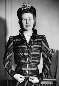00040 Prints: Clothing: Plaid taffeta costume with buttons of eggs and egg cup. March 1941 P008617