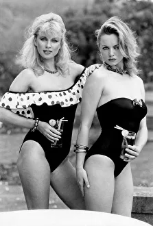 Clothing Sport Beach. Two women model an off the shoulder polka dot trimmed swimming