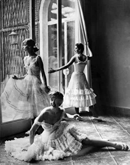 Clothing - Underclothing. Three women model petticoat dresses