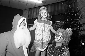 A clown and Father Christmas visiting Kemplah Primary School, Guisborough. December 1985