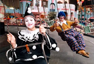 Swings Prints: Clowns Matthew Tate and Daren Ridley trying the swings in Metroland
