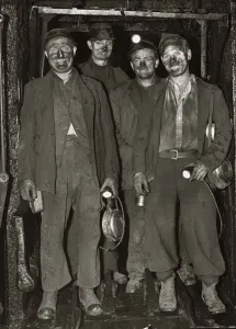 Underground Prints: Coal Miners return to the surface after a hard day digging for coal in the mines