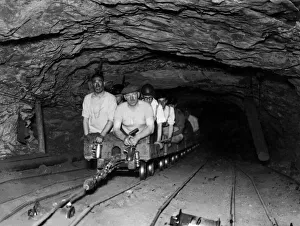 Subterrania Prints: Coal Mines underground scenes. Miners going to work by rail on a half mile trek to