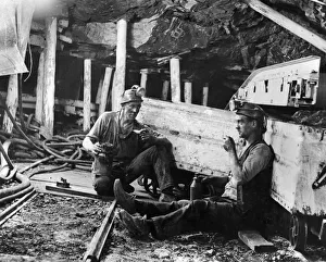 Coal Mines underground scenes. Workers having a break. December 1937