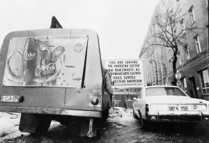 A Coca Cola lorry on the front line of freedom at a wind swept rainy day at Checkpot