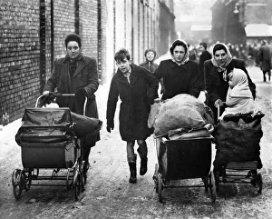 Coke queue Manchester. Pram loads of coke leaving Gaythorne Gasworks this morning