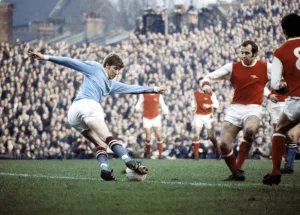 Colin Bell in action for Manchester City against Arsenal during their English League