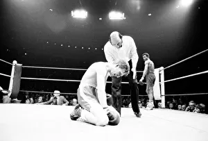00090 Prints: Colin Jones of Wales on the floor after a low punch in the 8th round of his defence of