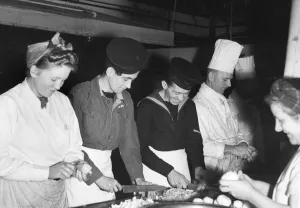 Kitchen Prints: Collecting dirty dishes at the Strand Corner House is the way some soldiers