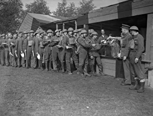 Queue Prints: Come to the cookhouse door. Serving out dinner at an anti aircraft battery at an