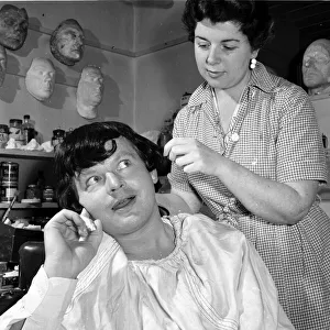 Comedian Benny Hill seen here having a wig fitted in the make up workshop